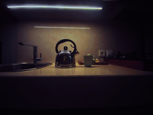black kettle on brown wooden table