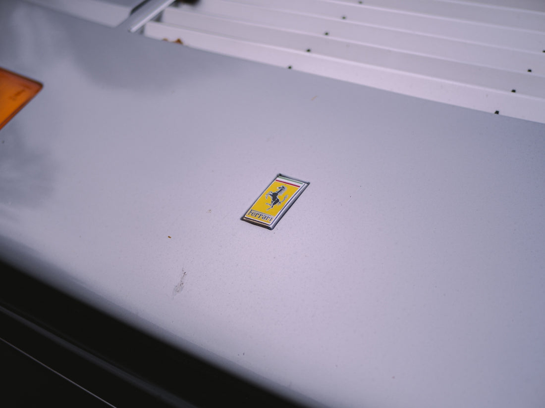 a yellow sticker on a white wall