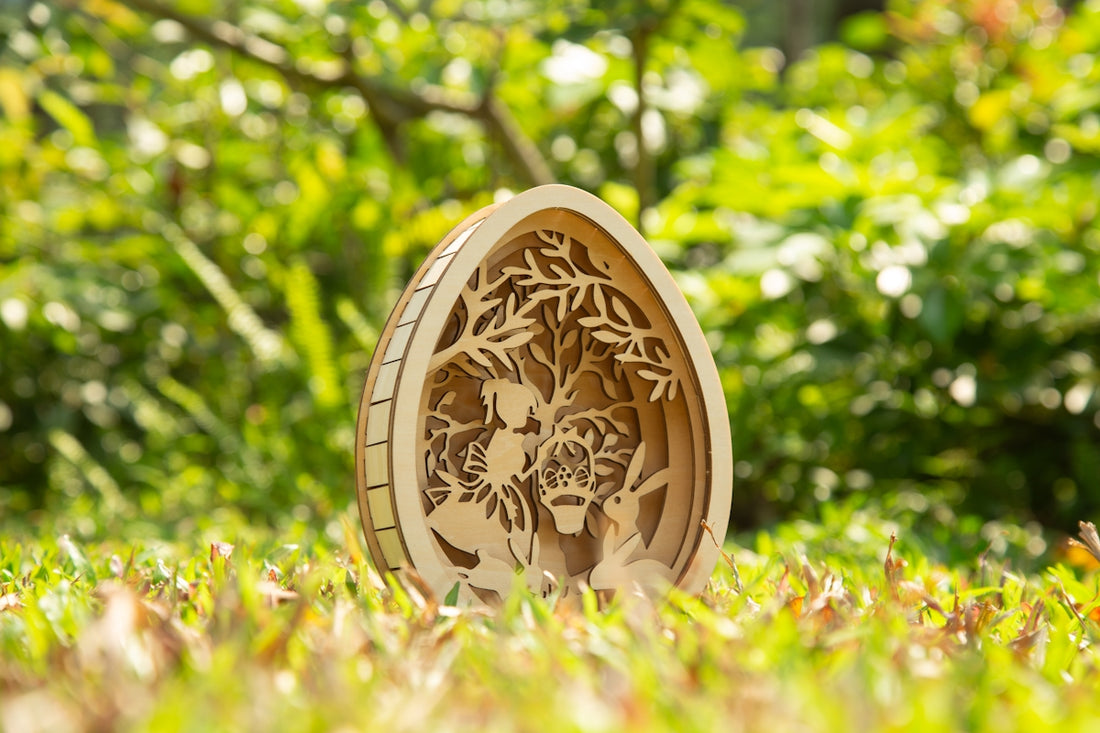 A wooden egg art piece sits on green grass.