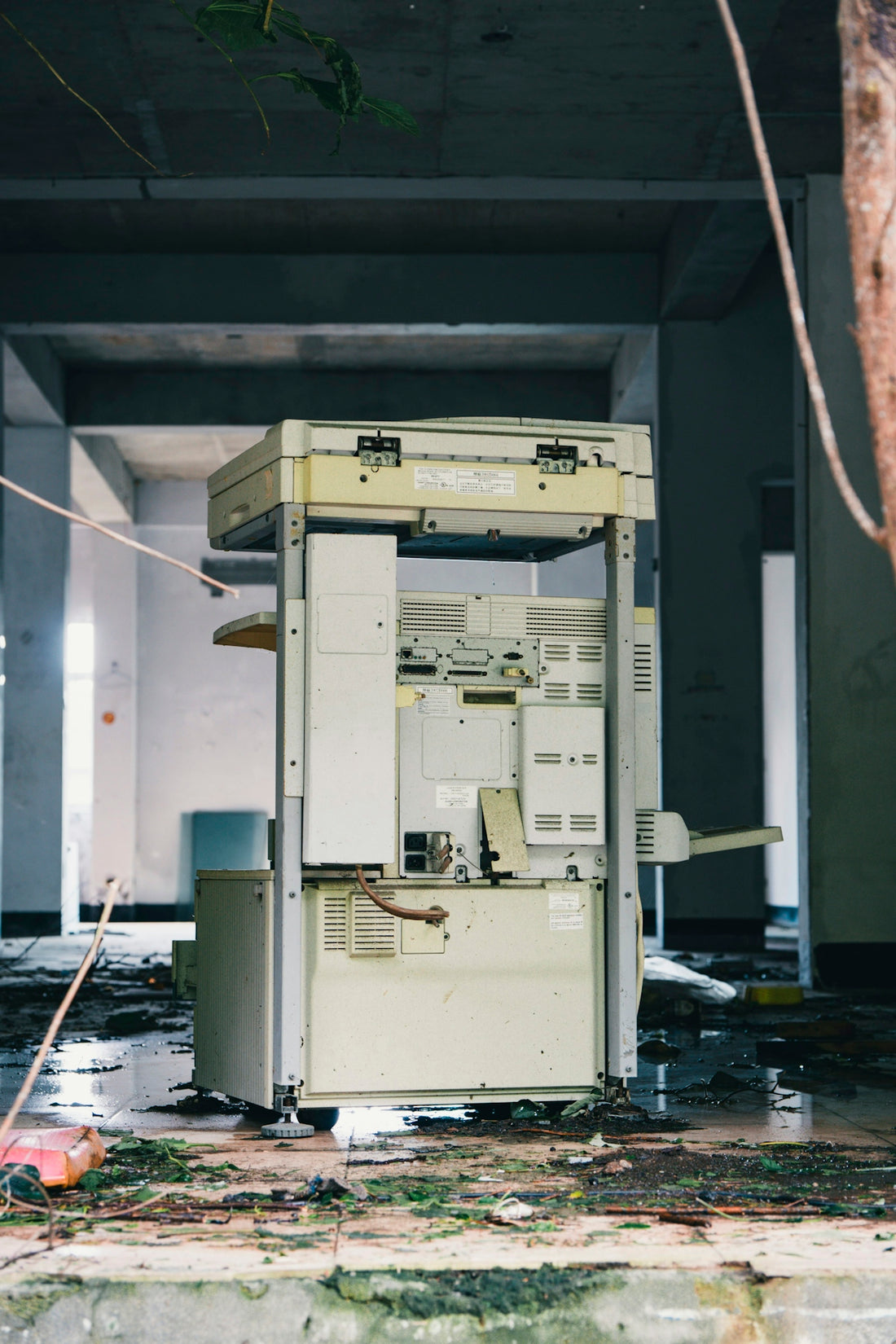 Abandoned office building with a broken photocopier.