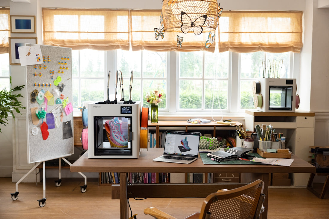 3D printers and crafting supplies on a desk.