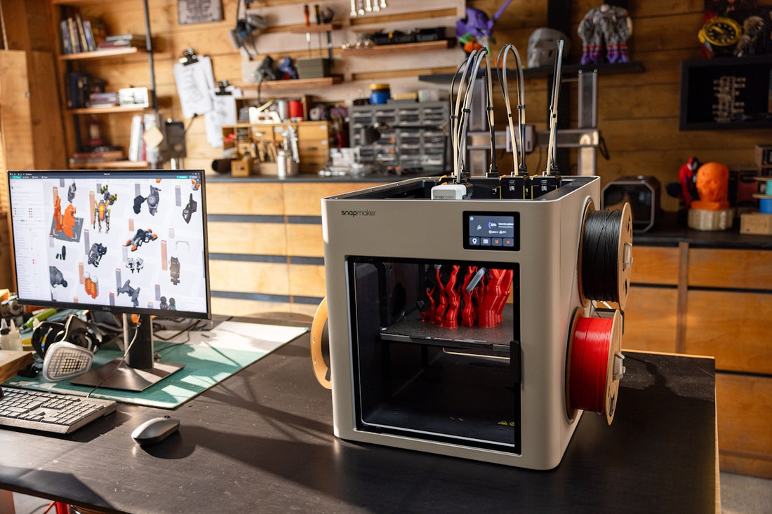 3D printer with filament spools in workshop.