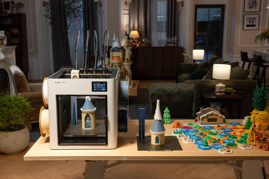 3D printer creating a miniature castle model.