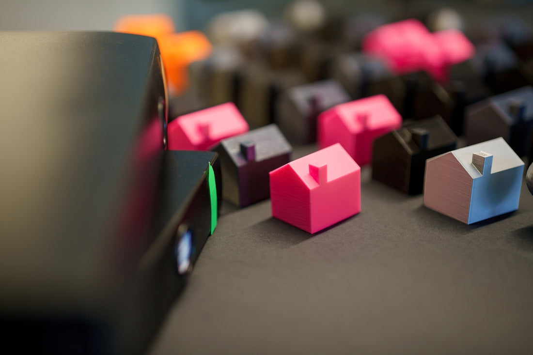 Many small colorful houses arranged in rows.